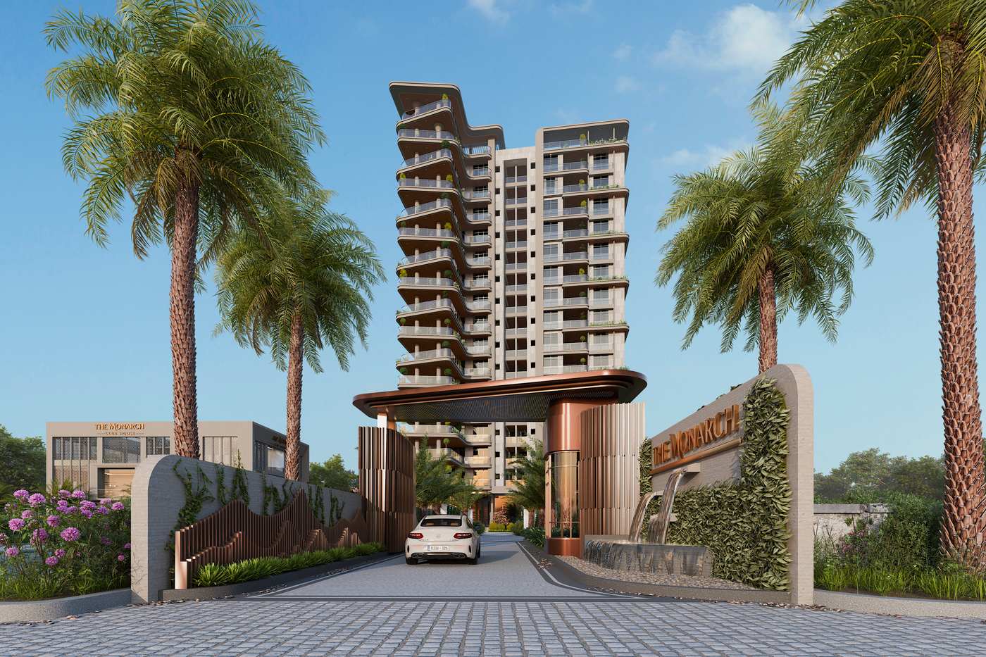 The arrival drive at The Monarch, framed by palms and the sculpted entrance canopy