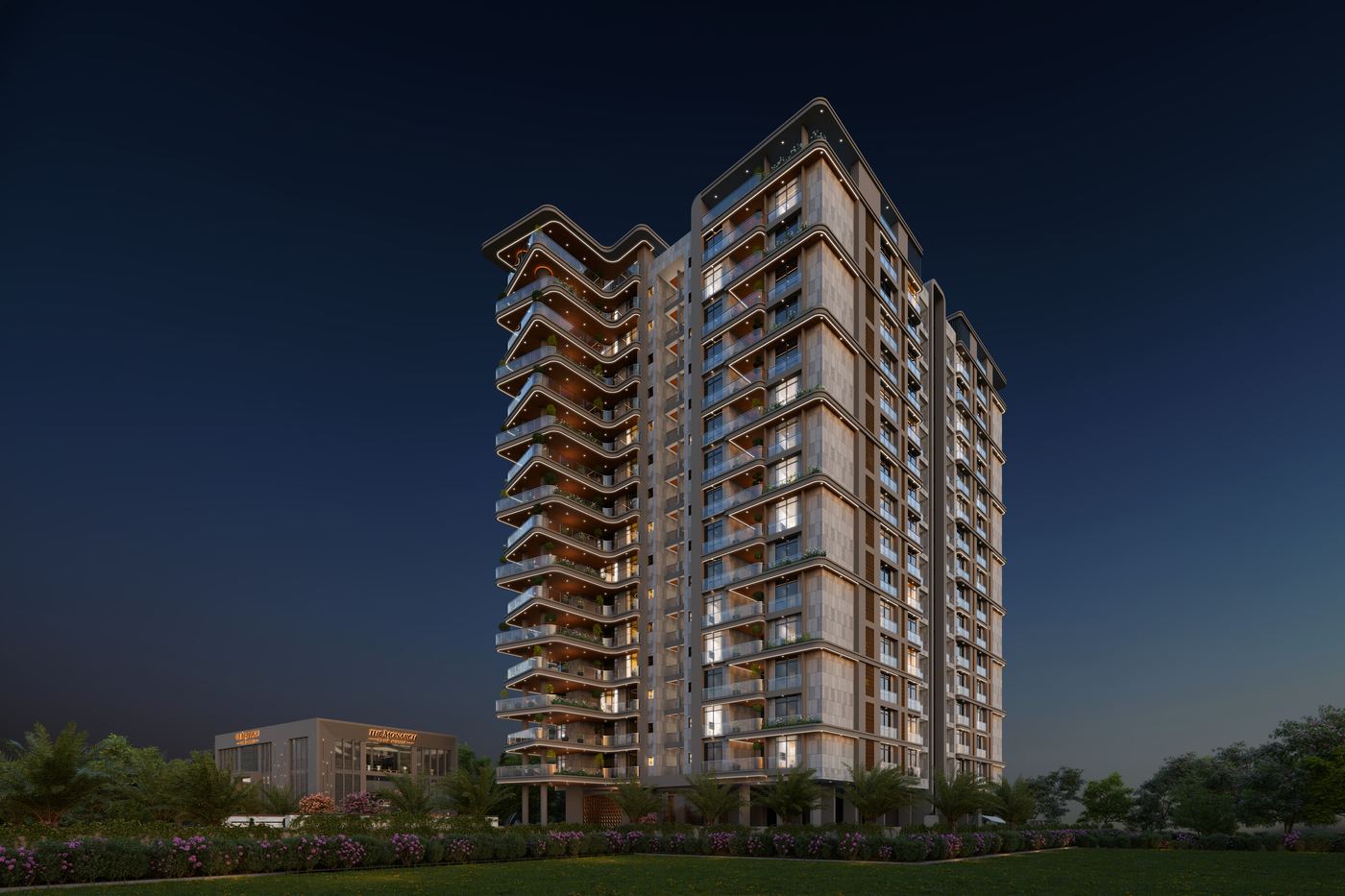 The Monarch tower at dusk, its sculpted balconies lit from within